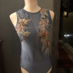 Plum Patrick J Leo. Custom stones and appliqués.